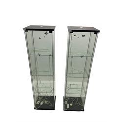 Two four sided glass display cabinets