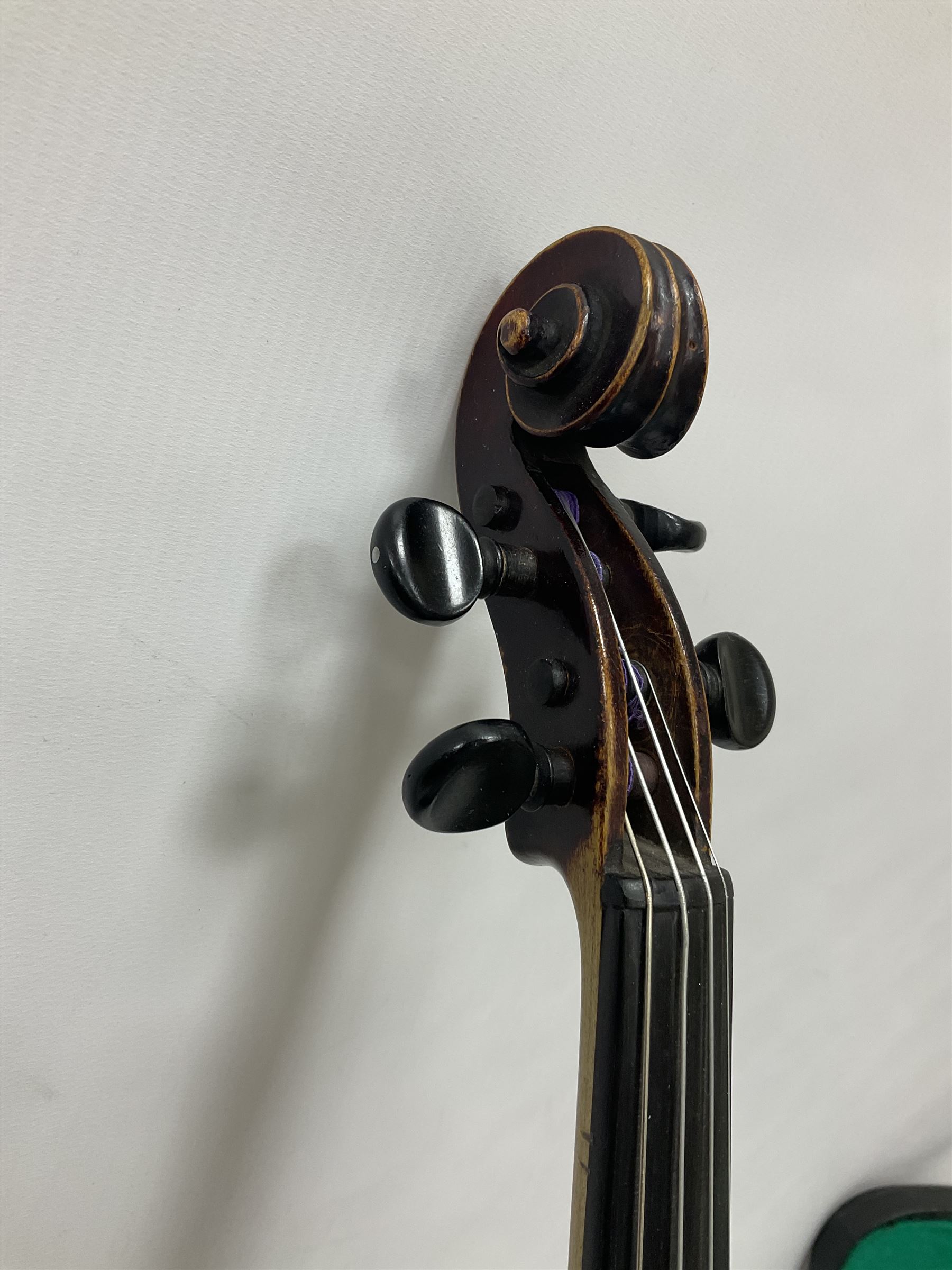 Neuner & Hornstiner early 20th century half size violin c1900, two piece maple back and ribs with a spruce top in a later ridged carrying case, no bow Length 57cm