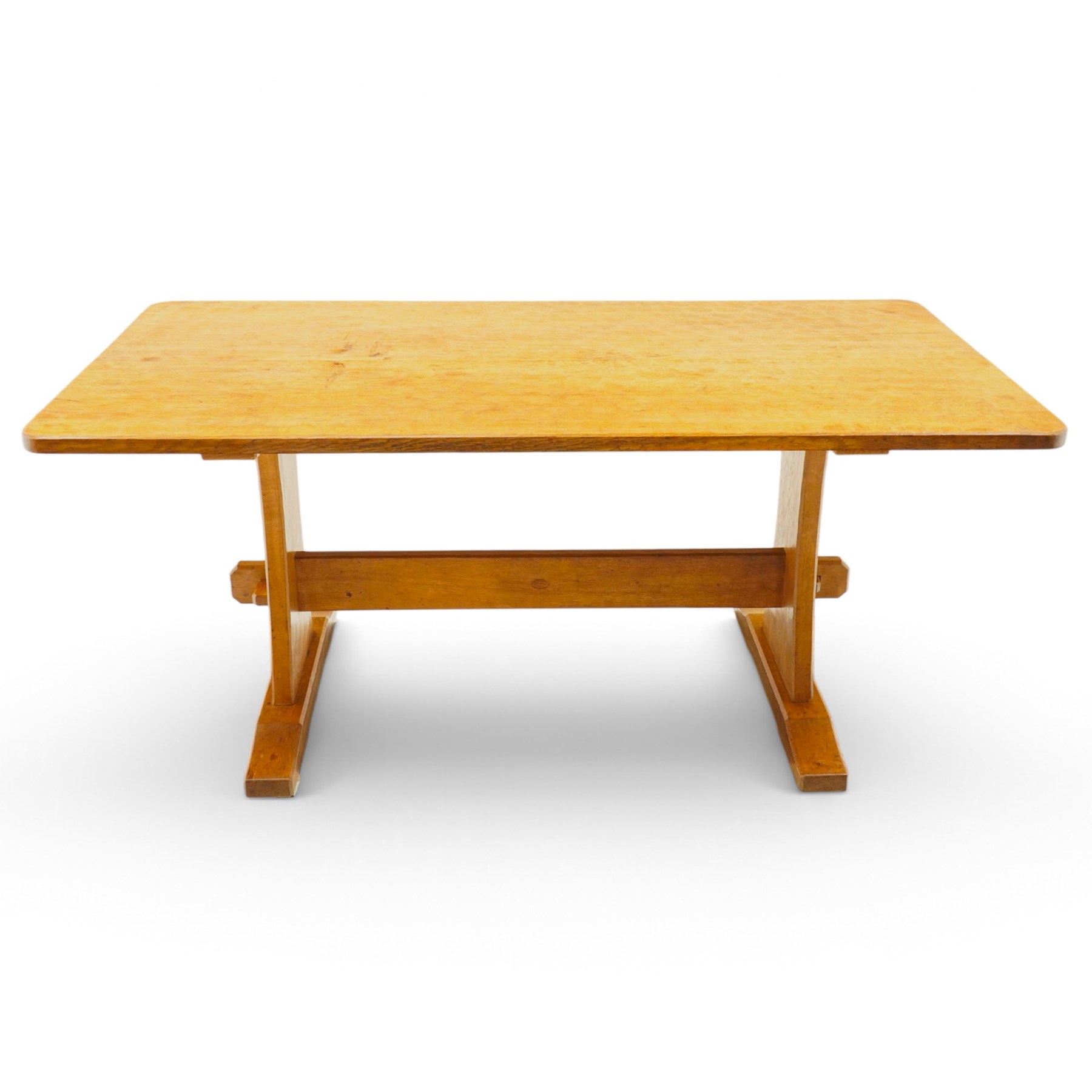 Acornman - adzed oak refectory dining table, rectangular adzed top with rounded corners raised on twin shaped end supports terminating to sledge feet united by pegged stretcher, carved with acorn signature
