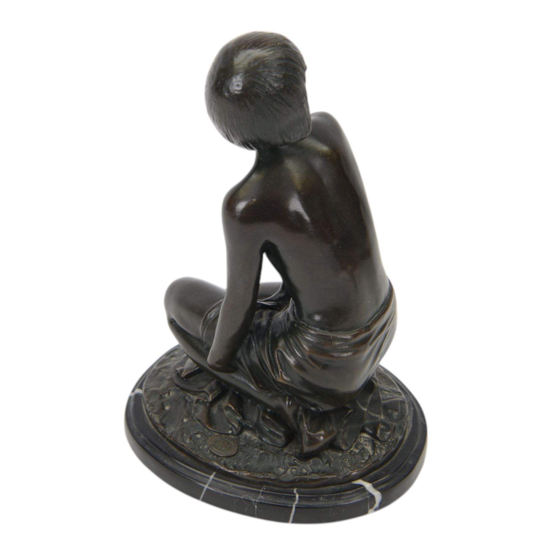 Art Deco style bronze study of a kneeling semi-nude female, after  Amadeo Gennarelli with signature to base, upon a black marble effect plinth, H23cm
