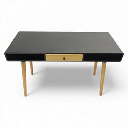 Modern black single drawer desk, black rectangular top above a single oak veneered drawer with black metal pull, flanked by two open shelves raised on tapering oak veneer legs (From floor to underside 64cm)