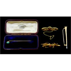 Early 20th century 14ct gold hunting horn brooch, two 9ct gold stone set brooches and a 9ct gold cabochon turquoise stick pin