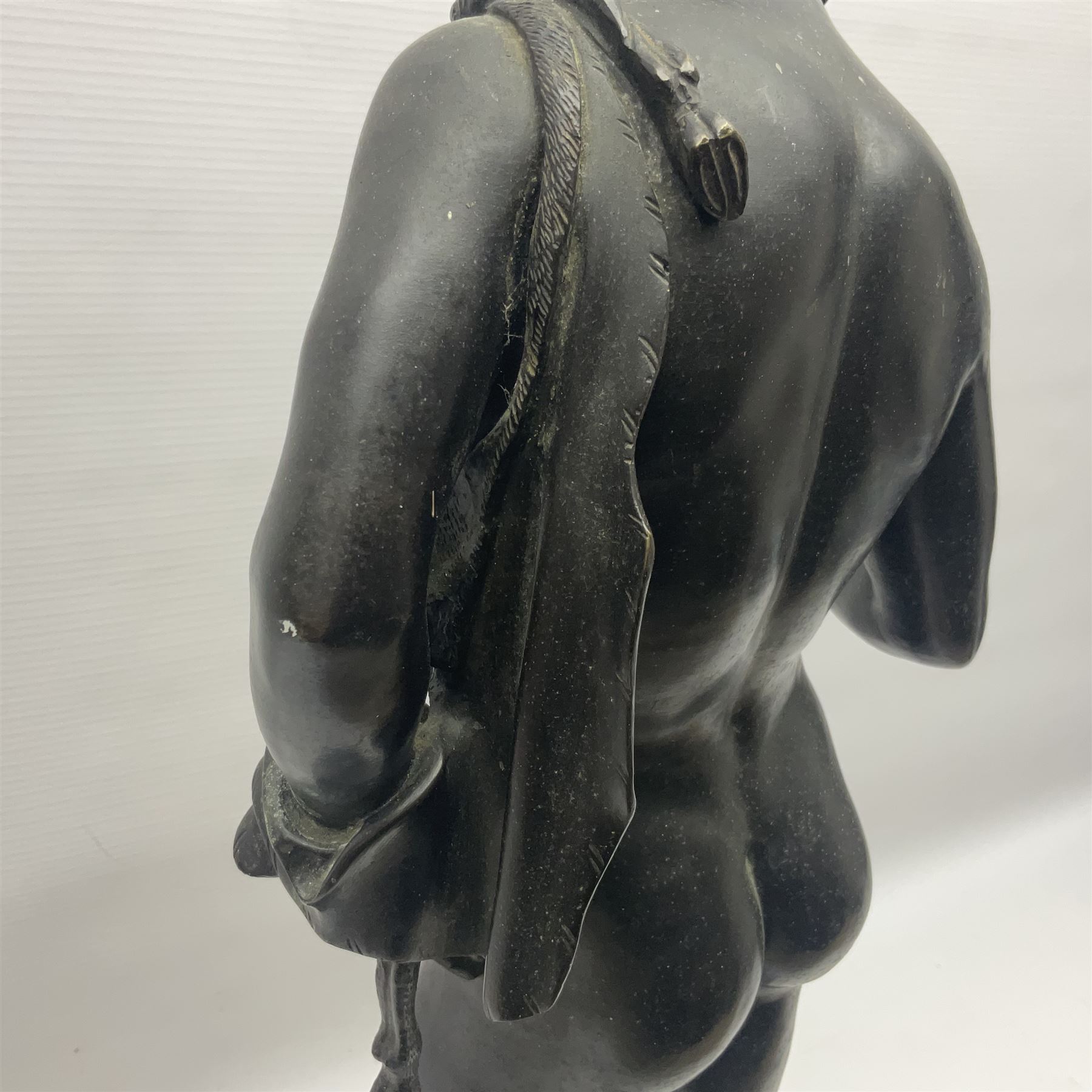 Bronzed classical nude male figure, upon a stepped circular base, H61cm 