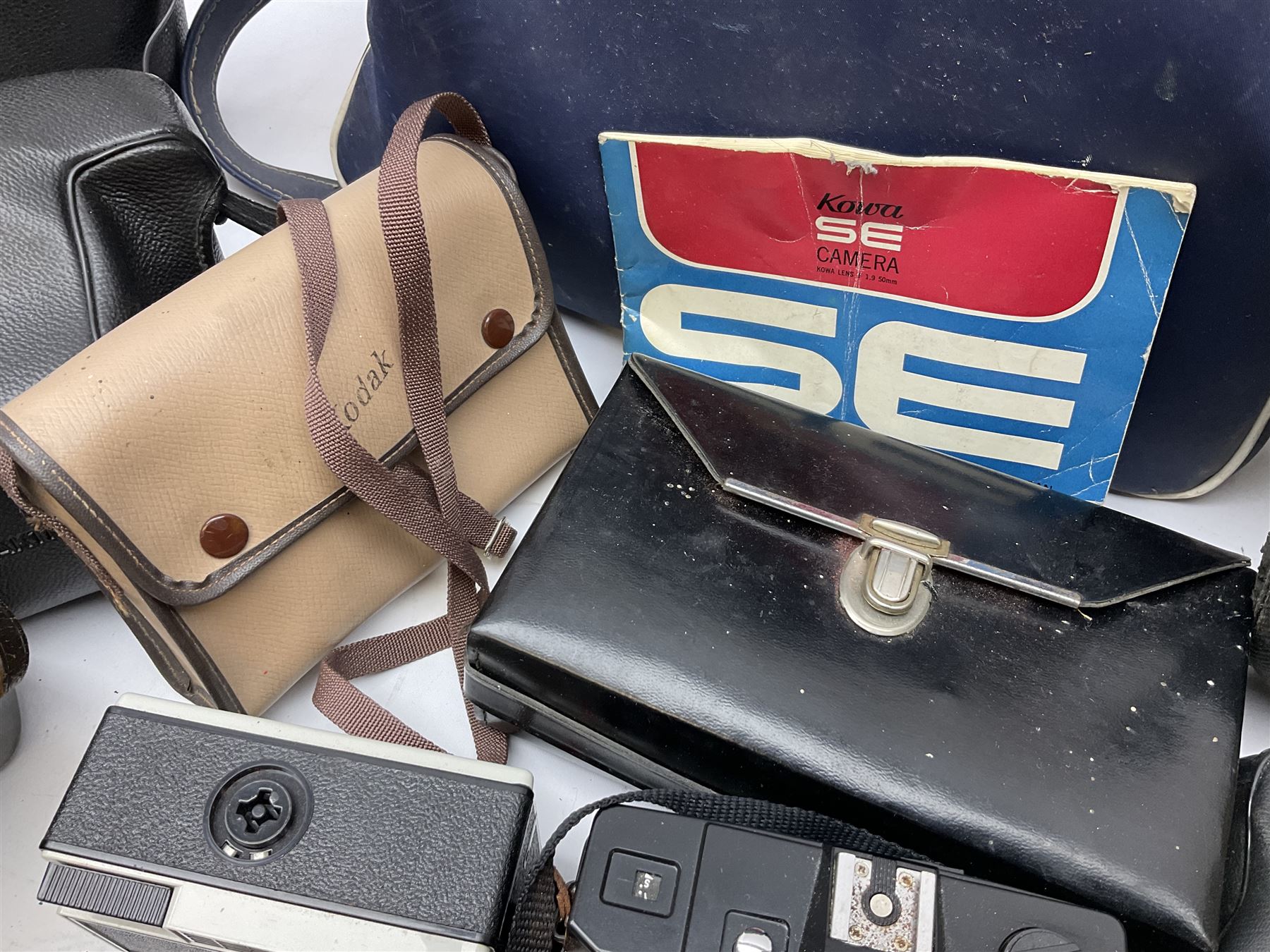 Quantity of Cameras , Lenses and Table Top Viewer- To be assessed 
Collection of cameras, lenses and photography equipment, to include Praktica EE2, Kowa SE, Kodak 66 model II, Inovar, lens Carl Zeiss Jena DDR Flektogon 2.4/35, lens Pentacon Electric f/2.8 135mm, Sunpak auto 2020, tripod  etc, together with a pair of Mark Scheffel 10x50 field binoculars.  