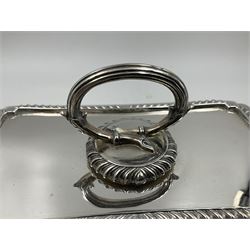 Early 20th century silver entree dish and cover, of rectangular form with shaped corners and oblique gadrooned borders to base and cover, the cover with loop 'bamboo' handle, hallmarked Thomas Bradbury & Sons Ltd, Sheffield 1930, including handle H10.5cm L24.5cm