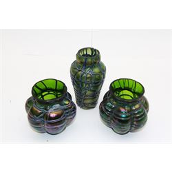 Three Austrian Art Nouveau Kralik iridescent glass vases, to include two of squat baluster form and a taller example, all green with threaded vein decoration to body, tallest H13.5cm