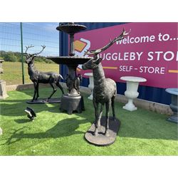Pair of cast iron life-size garden stags, bronze finish on oval plinth bases H154, W105, D50 - THIS LOT IS TO BE COLLECTED BY APPOINTMENT FROM DUGGLEBY STORAGE, GREAT HILL, EASTFIELD, SCARBOROUGH, YO11 3TX