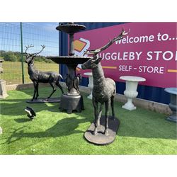 Pair of cast iron life-size garden stags, bronze finish on oval plinth bases H154, W105, D...