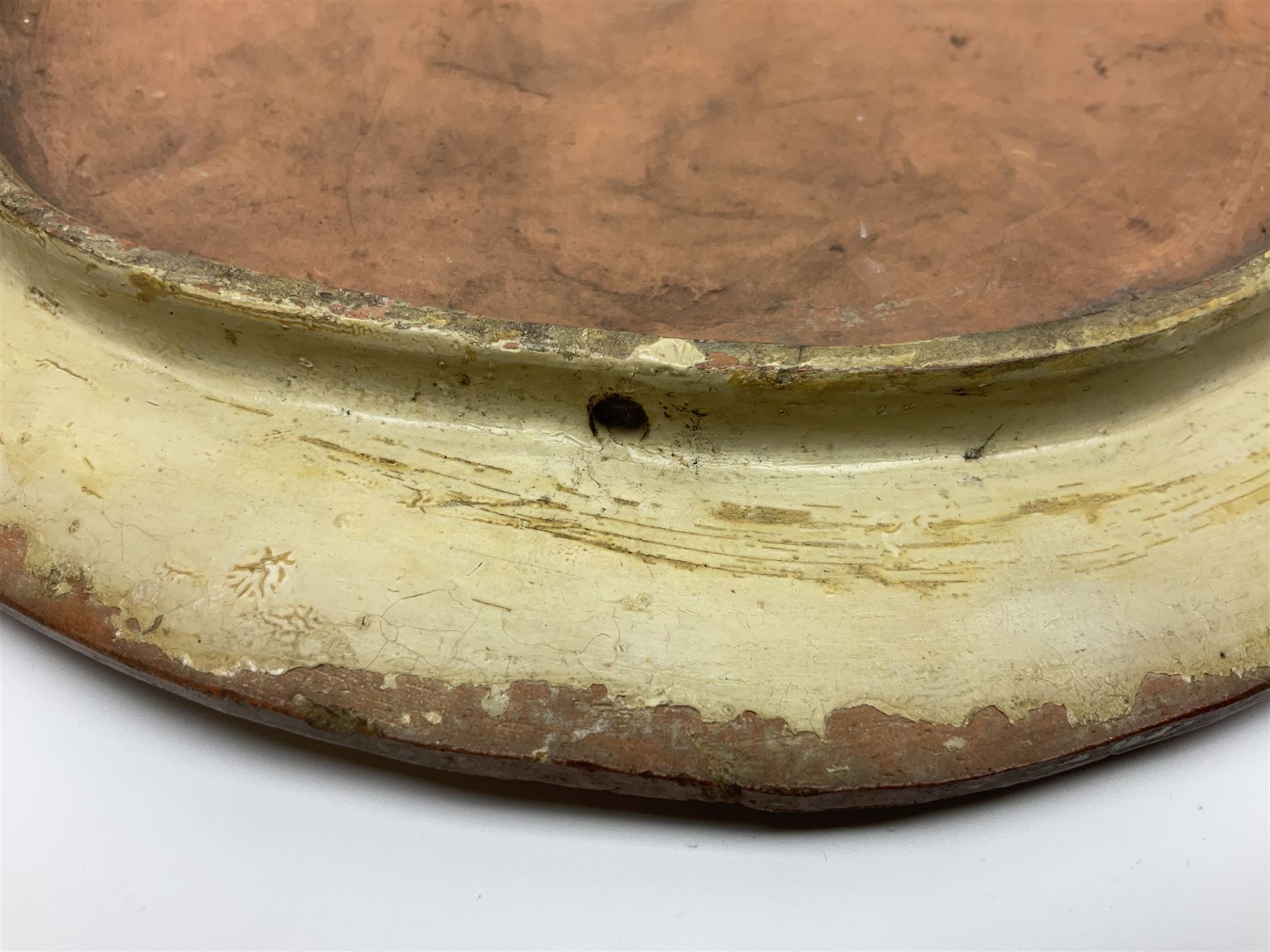 Pair of 19th century classical terracotta relief wall plaques depicting the goddess Hygeia and another goddess, seated holding an ewer, each of oval form, indistinctly signed, each stamped Ferreira verso, H42cm, W30cm