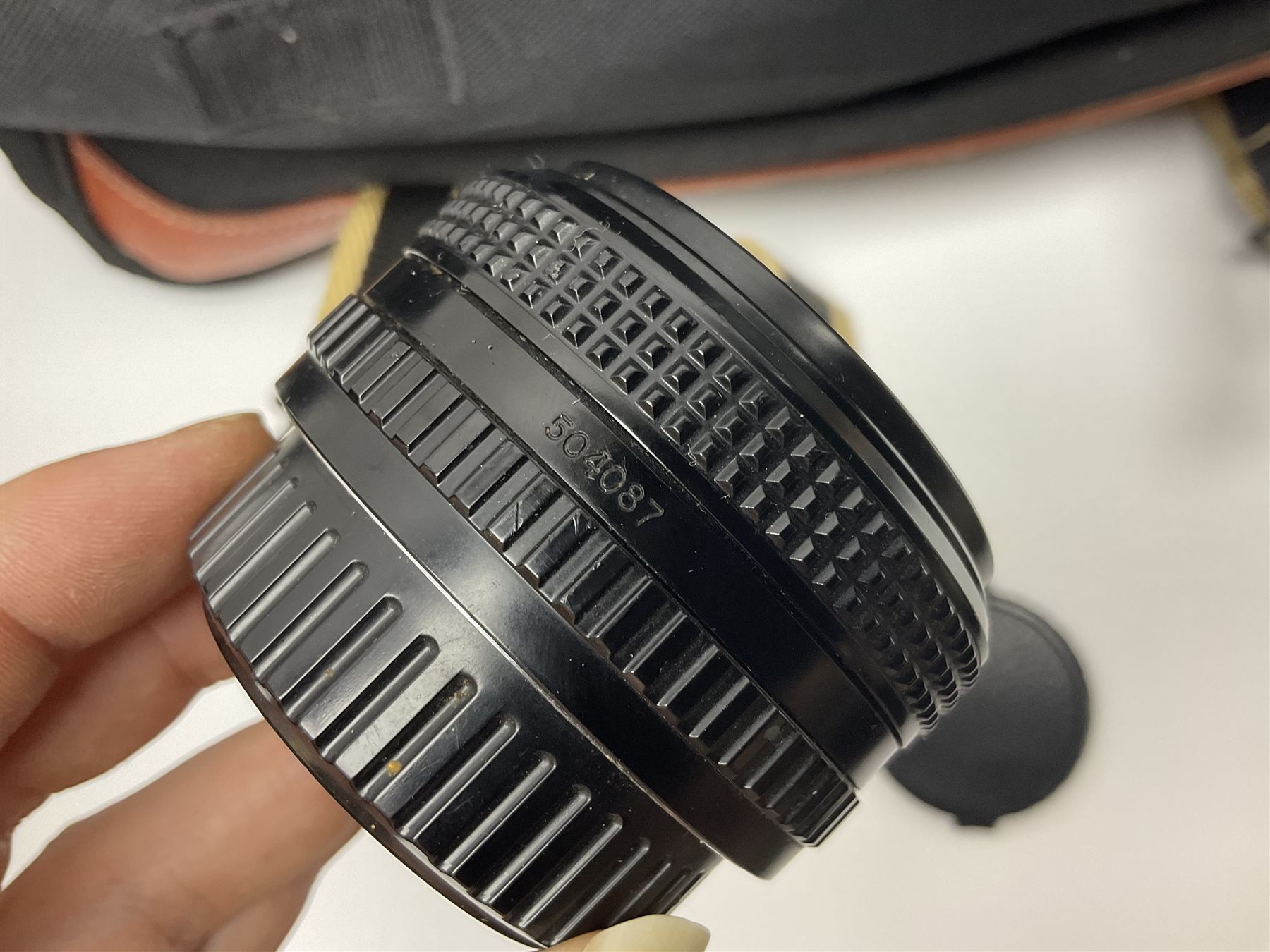 Four camera bodies, to include, Ricoh KR-10 serial no. 38826, Pentax MZ-M serial no. 4185969 with 'SMC Pentax- M 1:3.5 28mm' lens, Canon EOS500 serial no. 080927, with 'Sigma Zoom 100-300mm 1:4.5-6.7 DL'  lens etc, with other camera lenses and equipment 