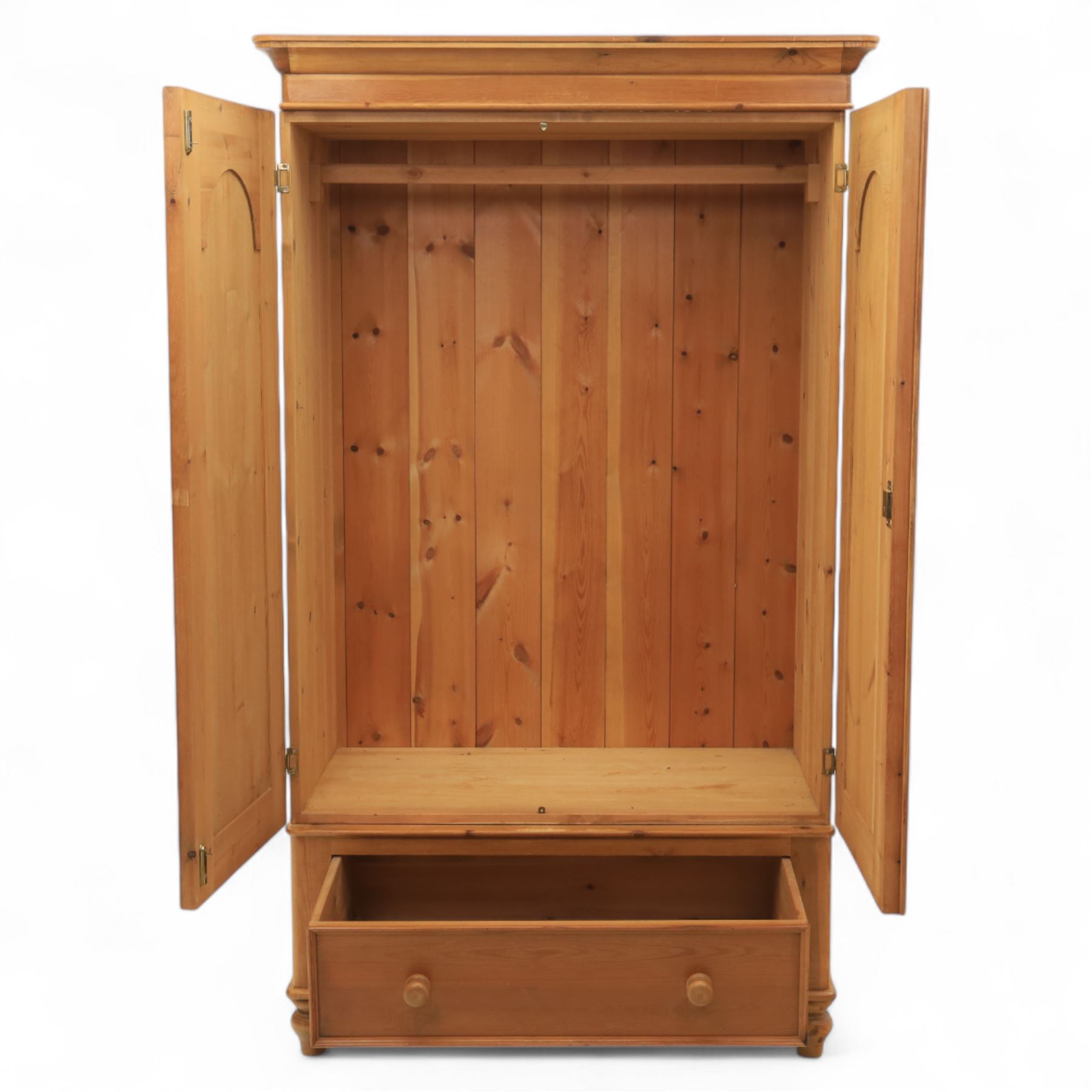 Two contemporary traditional-style wardrobes, projecting plain cornice above two arched moulded panel doors, above a full-width drawer fitted with turned wooden handles, raised on turned bun feet