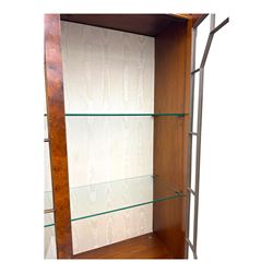 Ian Smith Furniture - Georgian design walnut bookcase on cupboard, projecting cornice above a pierced geometric frieze, featuring two astragal-glazed doors enclosing two adjustable shelves, the base with two drawers above a double cupboard, on a shaped plinth base