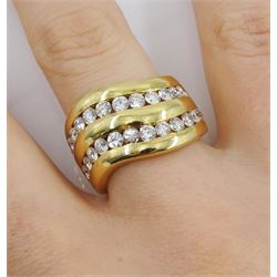 18ct gold two row channel set diamond ring, each row consisting of twelve round brilliant cut diamonds, stamped 750