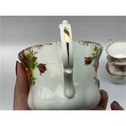 Royal Albert Old Country Roses pattern tea set, comprising teapot, coffee pot, six teacups and six saucers, five side plates, further teacup with joined saucer and side plate, open sucrier, milk jug, cake plate, and preserve pot and cover, together with Royal Albert Jubilee Rose pattern sauce boat and stand, and Royal Albert Lavender Rose pattern cake stand. 