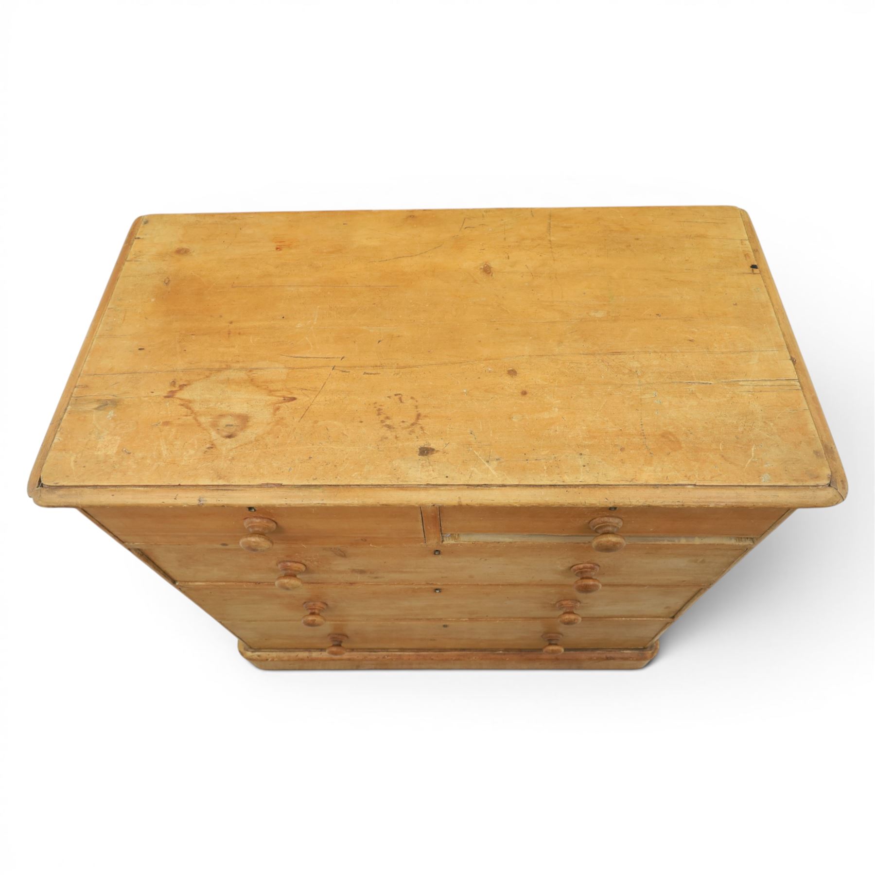 Victorian waxed pine chest, fitted with two short and three long drawers, turned wooden handles, raised on plinth base