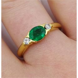 18ct gold oval emerald and diamond three stone ring, hallmarked