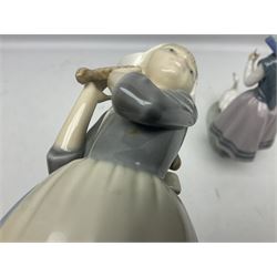 Three Lladro figures, comprising Dutch Girl with Braids no 5063, Dutch Girl with Duck no 5066 and Aracely with Ducks, all with original boxes, largest example H25cm