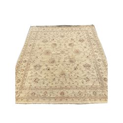 Persian beige ground carpet, repeating border, floral patterned field 