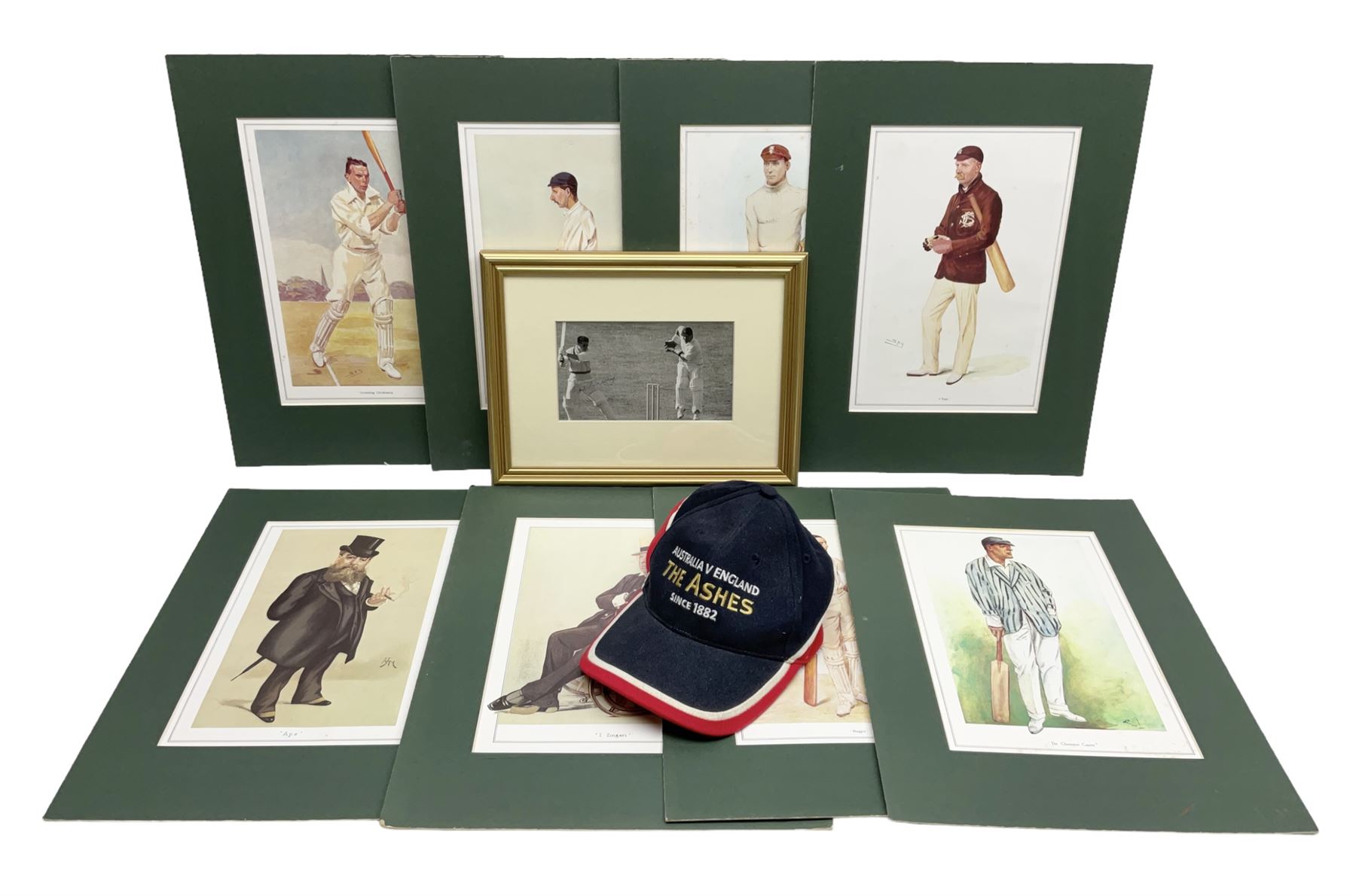 Cricket interest; signed original photograph of 1956 England V Australia Test match, cricket cap from England/Australia Test Match 2006 in Melbourne, eight coloured cricketing spy prints in mounts 