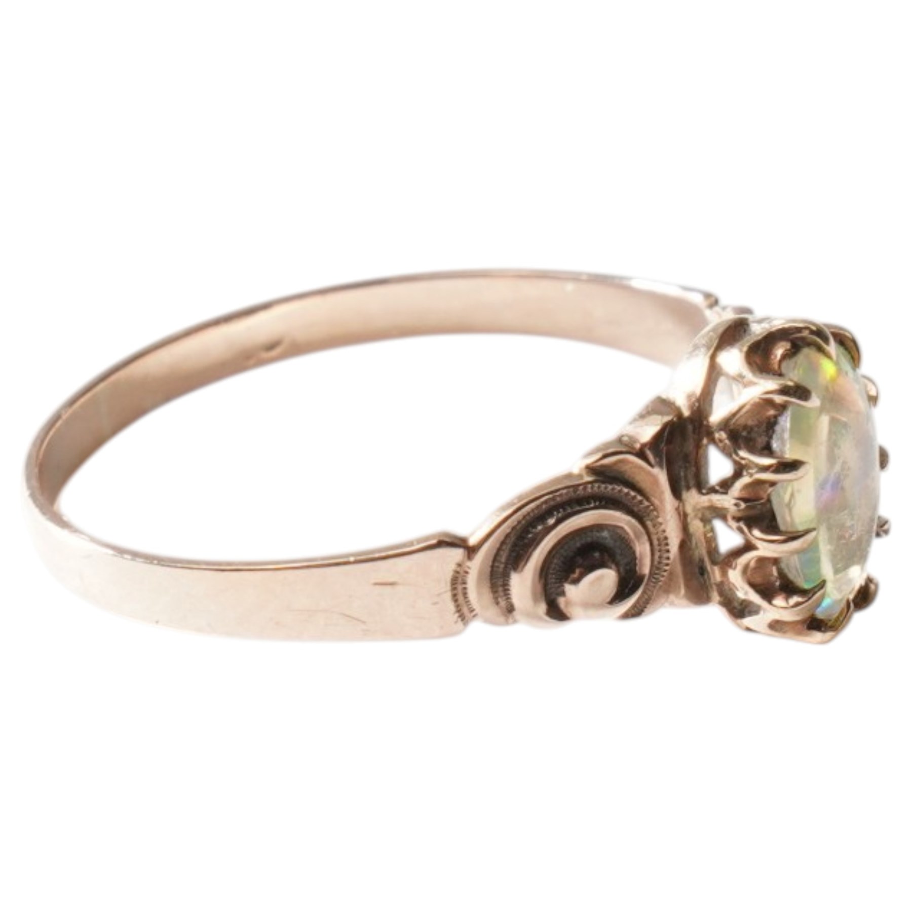 Gold single stone opal ring with scroll embossed shoulders