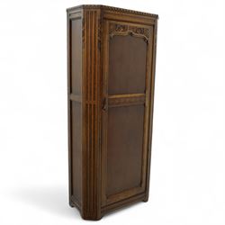 Early 20th century oak hall wardrobe, the single door with carved foliate frieze and mould...