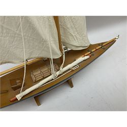 Wooden model of a schooner together with another similar example, largest example 48cm