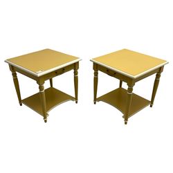 Pair of side lamp tables, square ovolo-moulded top over single drawer, on turned supports united by under-tier, in deep yellow and cream paint finish 