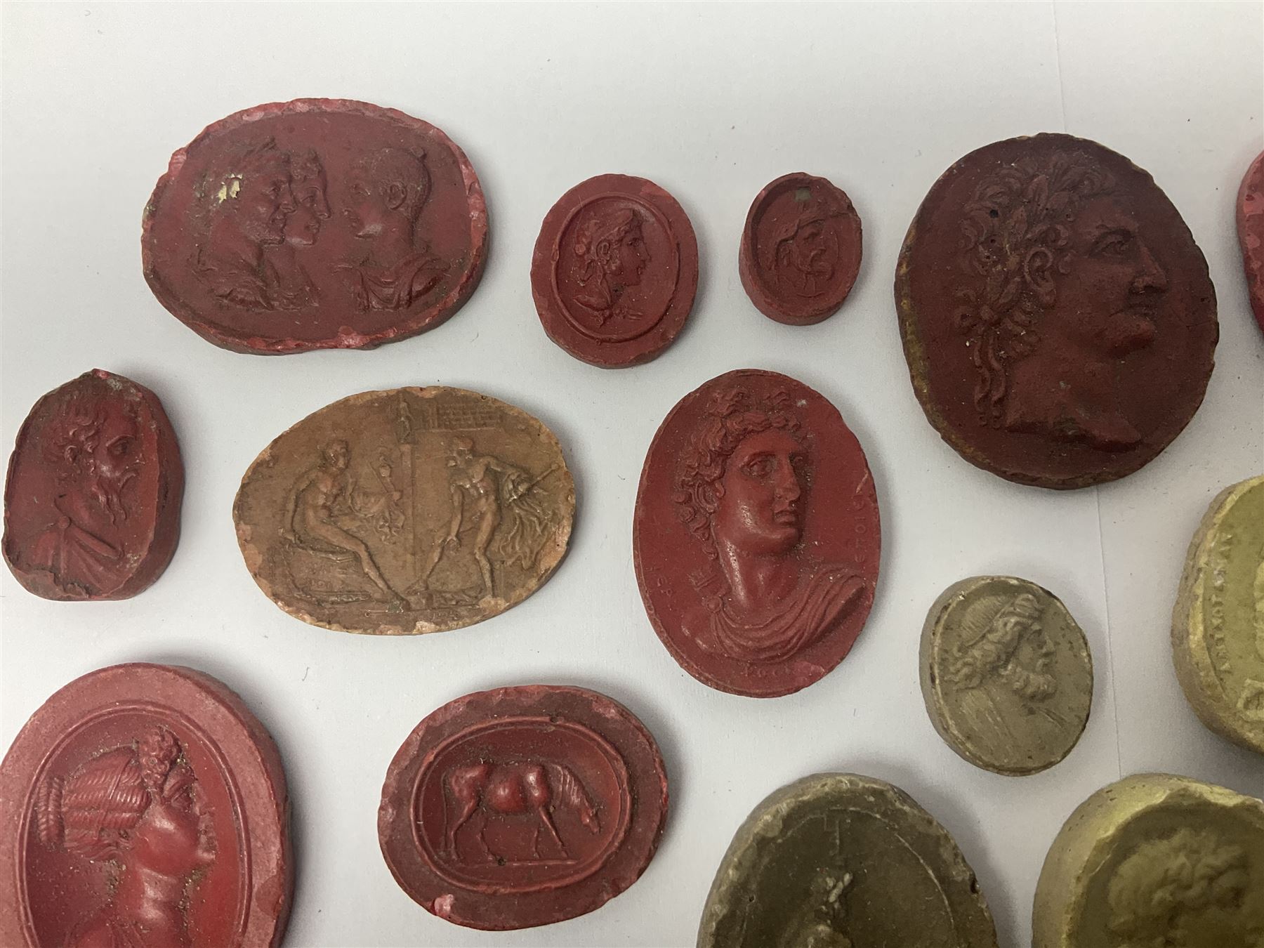 Large and impressive collection of Grand Tour cameos and intaglios (impronte), mostly red plaster examples