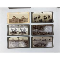 Early 20th century hand held slide action stereoscope viewer, Underwood & Underwood, publishers: The South African War through the stereoscope, stereo photographs mounted on card and captioned, in two double volume book form boxes with title labels and Underwood & Underwood  publishers: Hunting series through the stereoscope, stereo photographs mounted on card and captioned, in a single volume book form box   