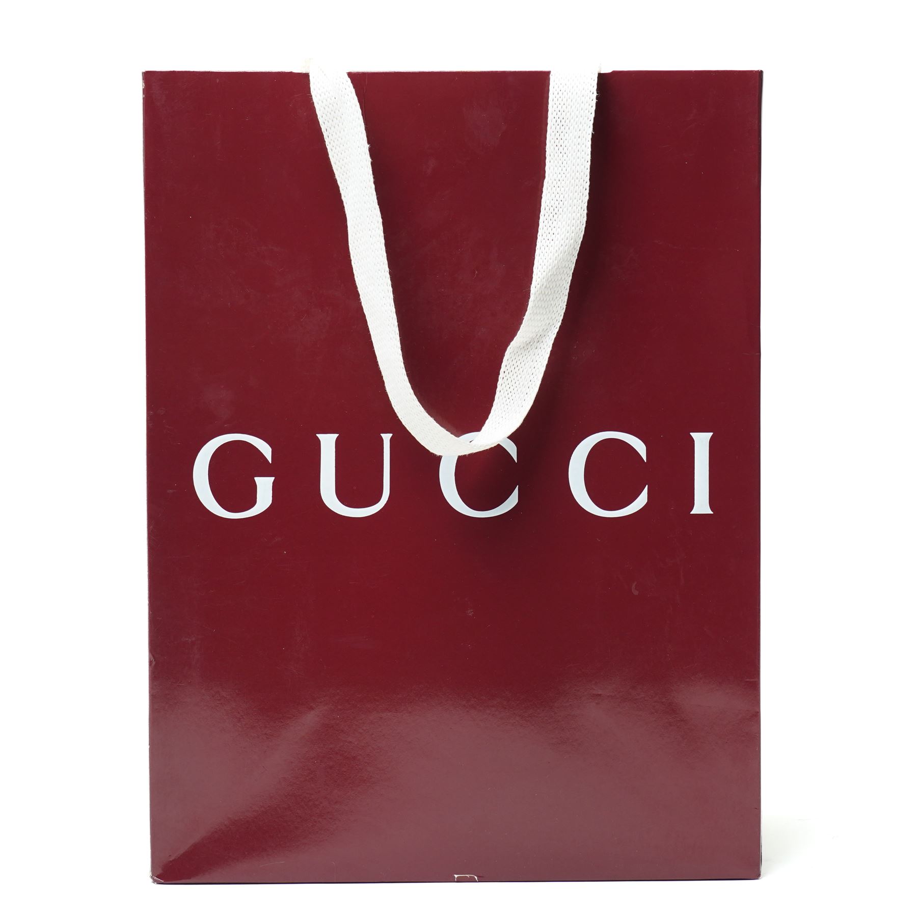 Gucci GG Marmont black matelassé leather top handle bag, made in Italy, with chevron quilted leather and heart motif to the reverse, antique gold-tone Double G front hardware, leather top handle and detachable chain shoulder strap with leather shoulder guard, front flap closure, suede-effect interior with zip pocket and leather logo tab stamped Gucci made in Italy, together with original Gucci dust bag and carrier, W27cm D11cm H20cm