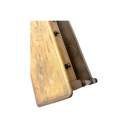 Late 19th century oak potboard dresser base, rectangular top over two frieze drawers with turned wooden handles, raised on four ring turned and tapering supports with block feet, united by a full-width lower potboard