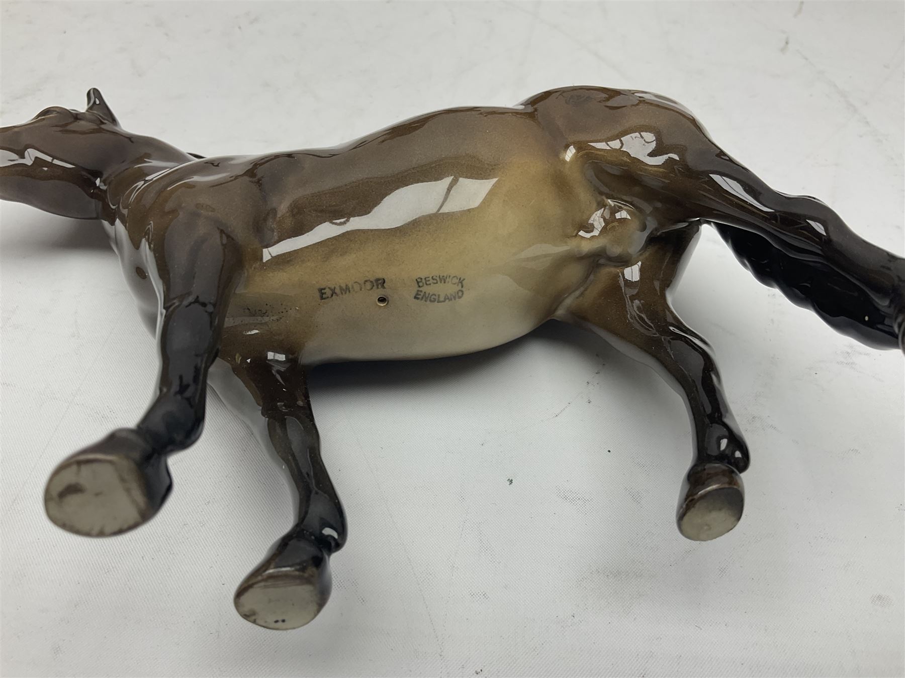 Four Beswick horses, including Exmoor no 1645, Black Beauty foal and two others 