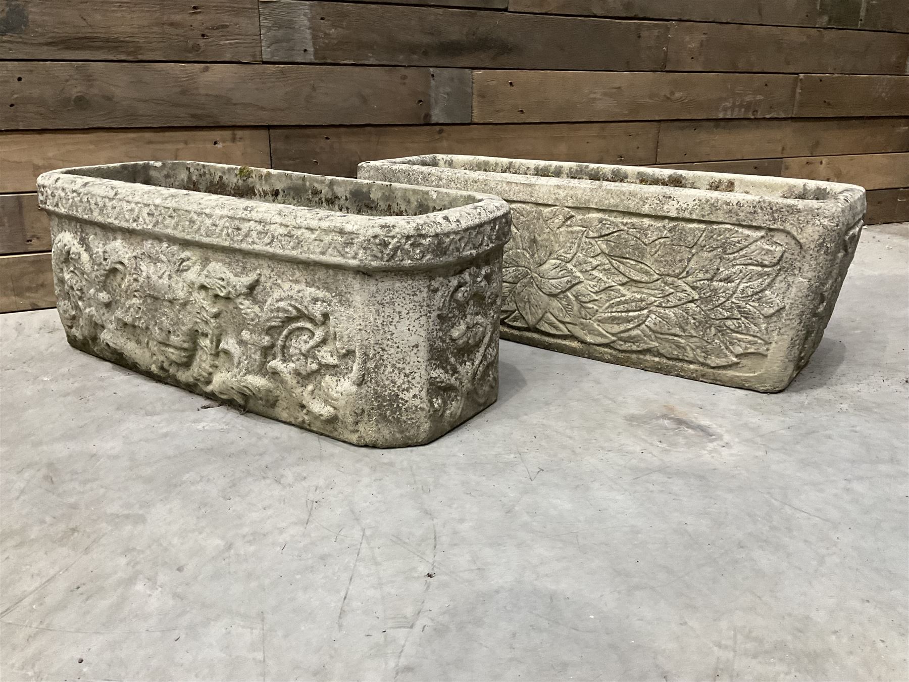 Ornate cast stone rectangular garden planter, lion mask and swag detail, and s similar planter (2)