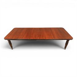 Large 19th century mahogany extending dining table with set of Chippendale design chairs, extending dining table with rectangular moulded top additional three leaves, raised on turned supports terminating in brass castors, the dining chairs (2 + 2) with shaped cresting rail and pierced splats, raised on square supports with stretchers