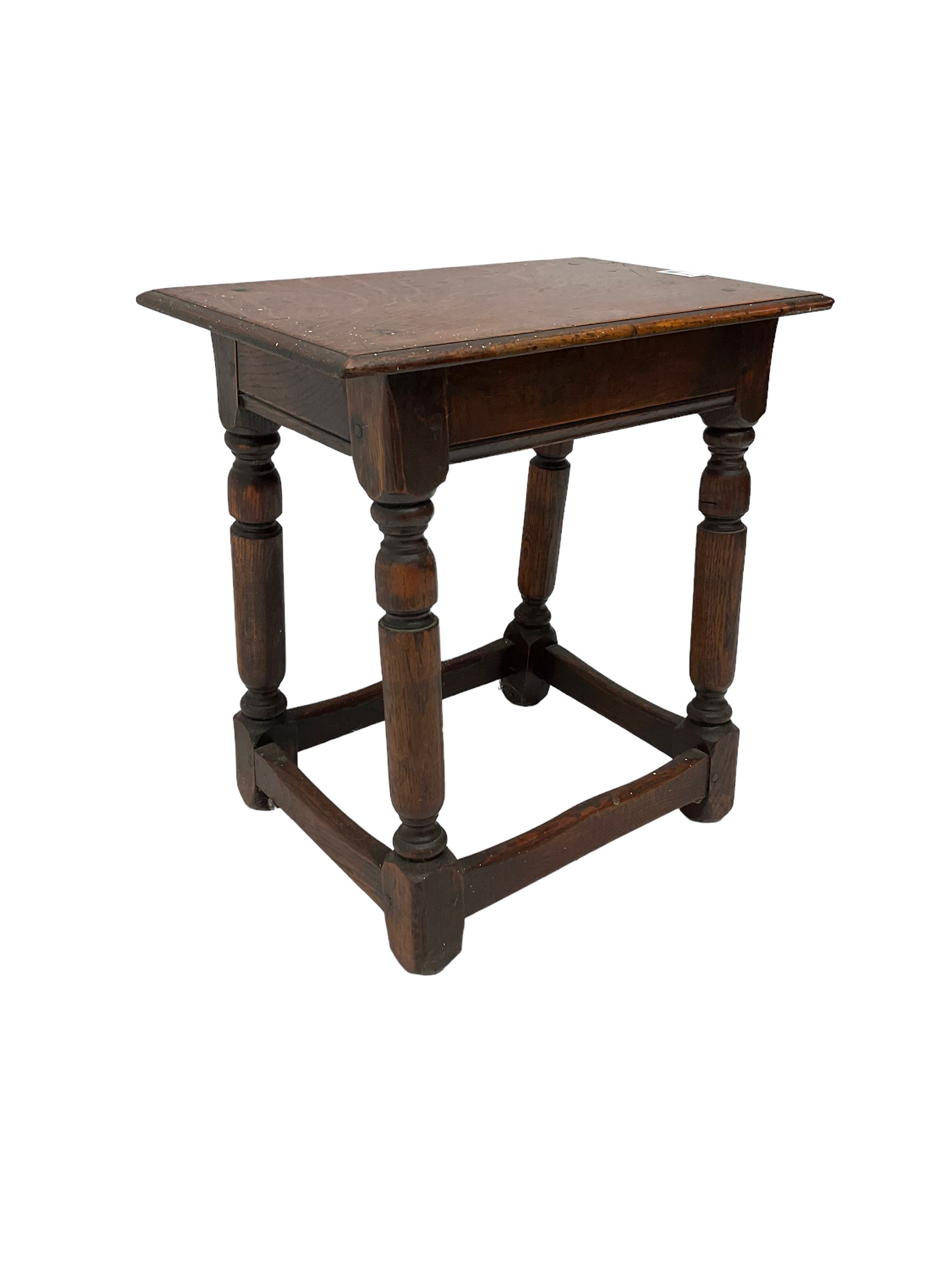 Oak coffin or joint stool, rectangular top with shaped edge over splayed turned supports with stretcher base 