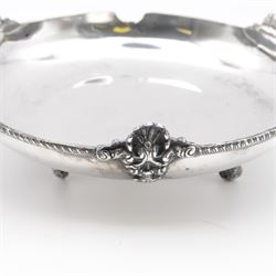 Egyptian silver bowl, of circular form, with oblique gadrooned rim and cast palmette decoration, upon three scroll feet, marked for 900 fineness, D20cm