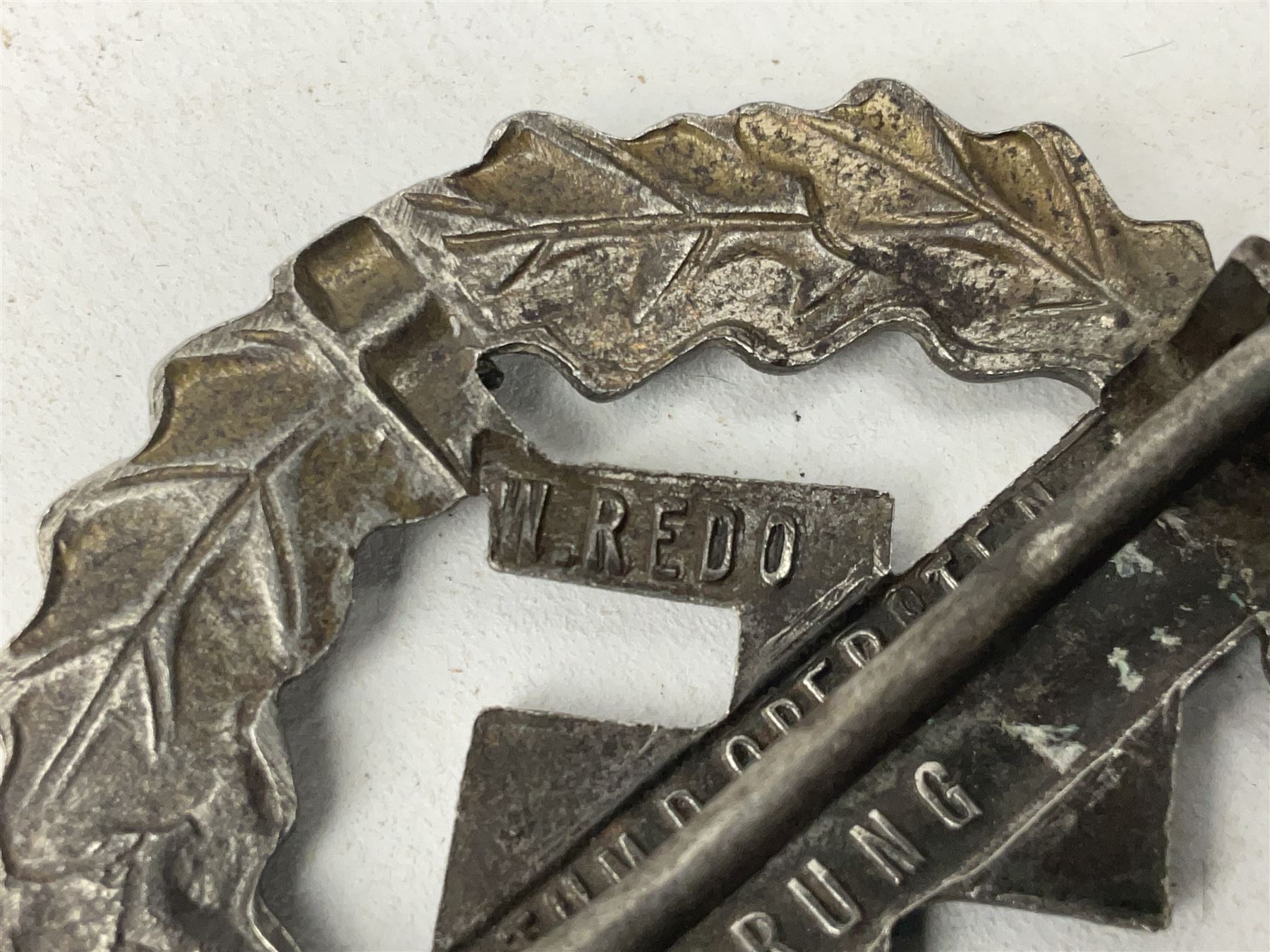 Two WW2 German Sports badges - SA sports badge marked verso 'W.Redo Eigentum D. Obersten SA. Fuhrung Saar Lautern'; and DRL sports badge marked verso 'Wernstein Jena D.R.G.M. 35269' (2)