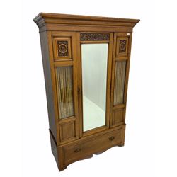 Edwardian oak wardrobe, single mirror door, glazed panels with decorative curtains behind, single drawer to base