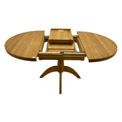 Solid light oak circular extending dining table, with leaf, on pedestal base