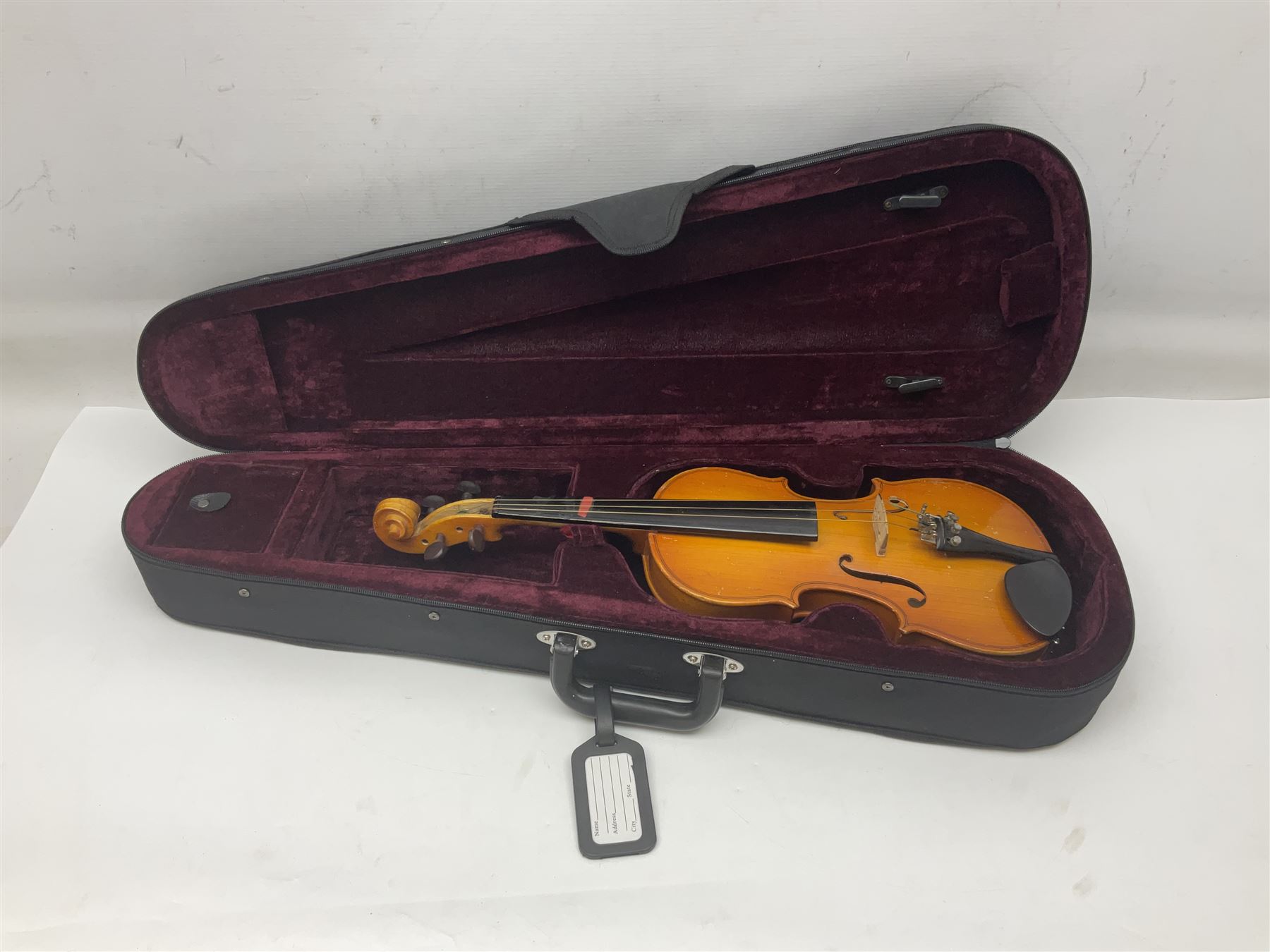 Four Chinese graduated violins - full size with 35.5cm two-piece back; three-quarter size with 33.5cm two-piece back; half size with 31cm two-piece back; and quarter size with 27.5cm two-piece back; all cased except full size; one with bow (4)