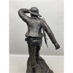 Early 20th century spelter effect figure of a sailor standing in the bow of a boat scanning the horizon, on a simulated rock base with a plaque entitled 'Rescue', base fitted with a timepiece clock movement and two-part dial, with pierced hands, gilt dial centre and ivorene chapter ring written in Arabic numerals, German HAC spring driven going barrel movement wound from the front; with pendulum H65.5cm
