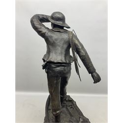 Early 20th century spelter effect figure of a sailor standing in the bow of a boat scanning the horizon, on a simulated rock base with a plaque entitled 'Rescue', base fitted with a timepiece clock movement and two-part dial, with pierced hands, gilt dial centre and ivorene chapter ring written in Arabic numerals, German HAC spring driven going barrel movement wound from the front; with pendulum H65.5cm
