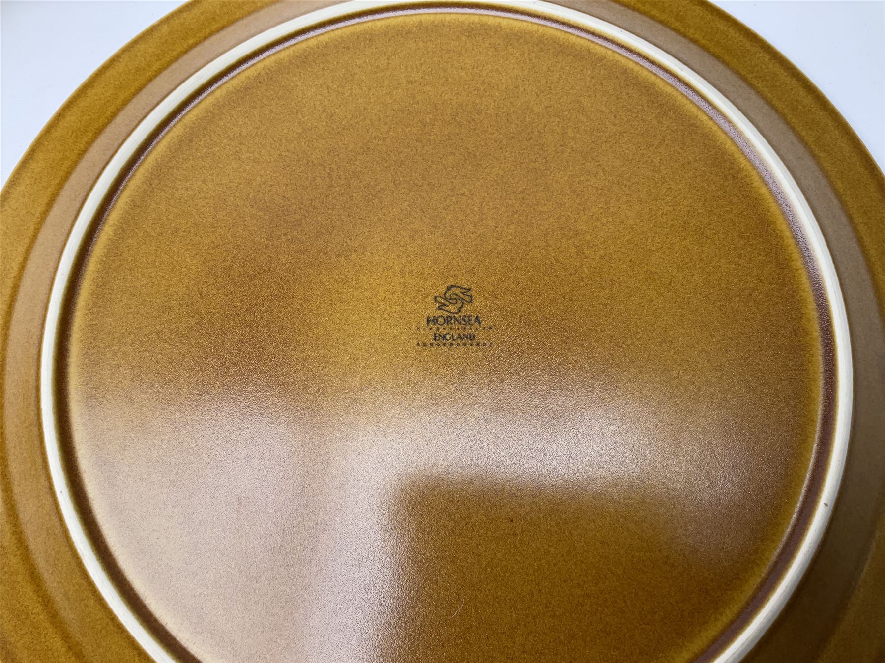 Hornsea Pottery Saffron pattern dinner and tea ware, comprising two lidded vegetable dishes, oval platter, nine dinner plates, six side plates, seven tea plates, covered tea caddy, covered coffee caddy, coffee pot, large jug, small jug, eight cups and seven saucers (45).  