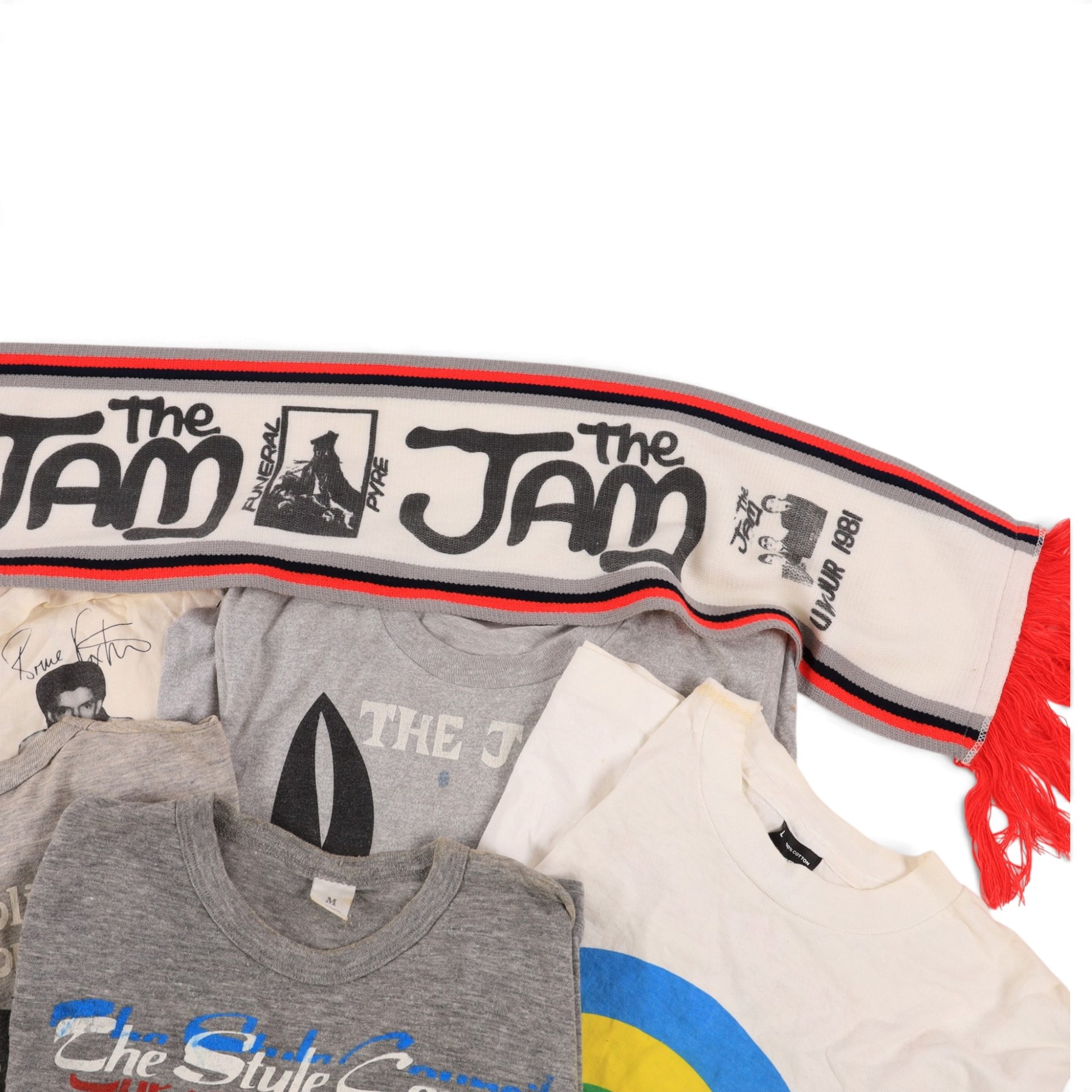 Five 1980s The Jam/Paul Weller/The Style Council tour/band t-shirts, including Cafe Bleu, The Paul Weller Movement, Dig The New Breed, A Solid Bond in Your Heart and Beat Surrender Tour 1982, together with a 1981 The Jam tour scarf and a Baby Axe Company miniature model of Paul Weller's Rickenbacker guitar