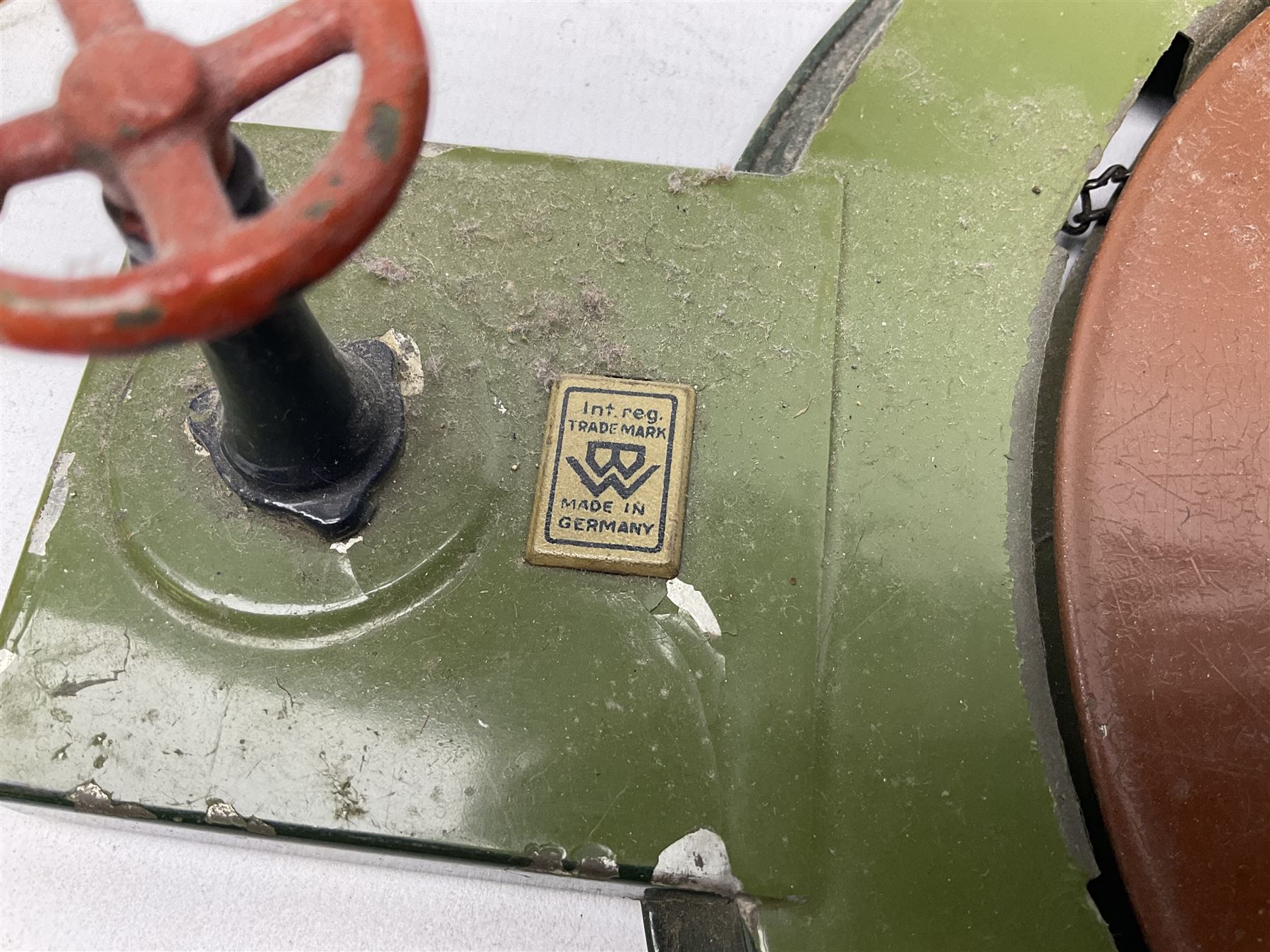 '0' gauge - Bing tin-plate two-storey double sided station with open walk-through to one end, rail side canopy, hinged doors and removable roof giving access to clock illumination L35cm; Bing hand-cranked turntable and open wagon; Marklin tin-plate level crossing barrier and Newspaper vendor's tin-plate four-wheel hand cart (5)