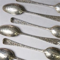 Eleven Victorian silver teaspoons, profusely engraved with floral decoration throughout with family crest to terminal, hallmarked Elkington & Co, Birmingham 1875