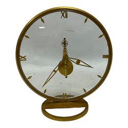 Jaeger Le Coultre- 8-day  Art Deco style circular skeleton clock c1960, gold plated case with translucent dials to the front and rear displaying the 16 jewelled Swiss movement and lever balance. Wound and set from the rear.