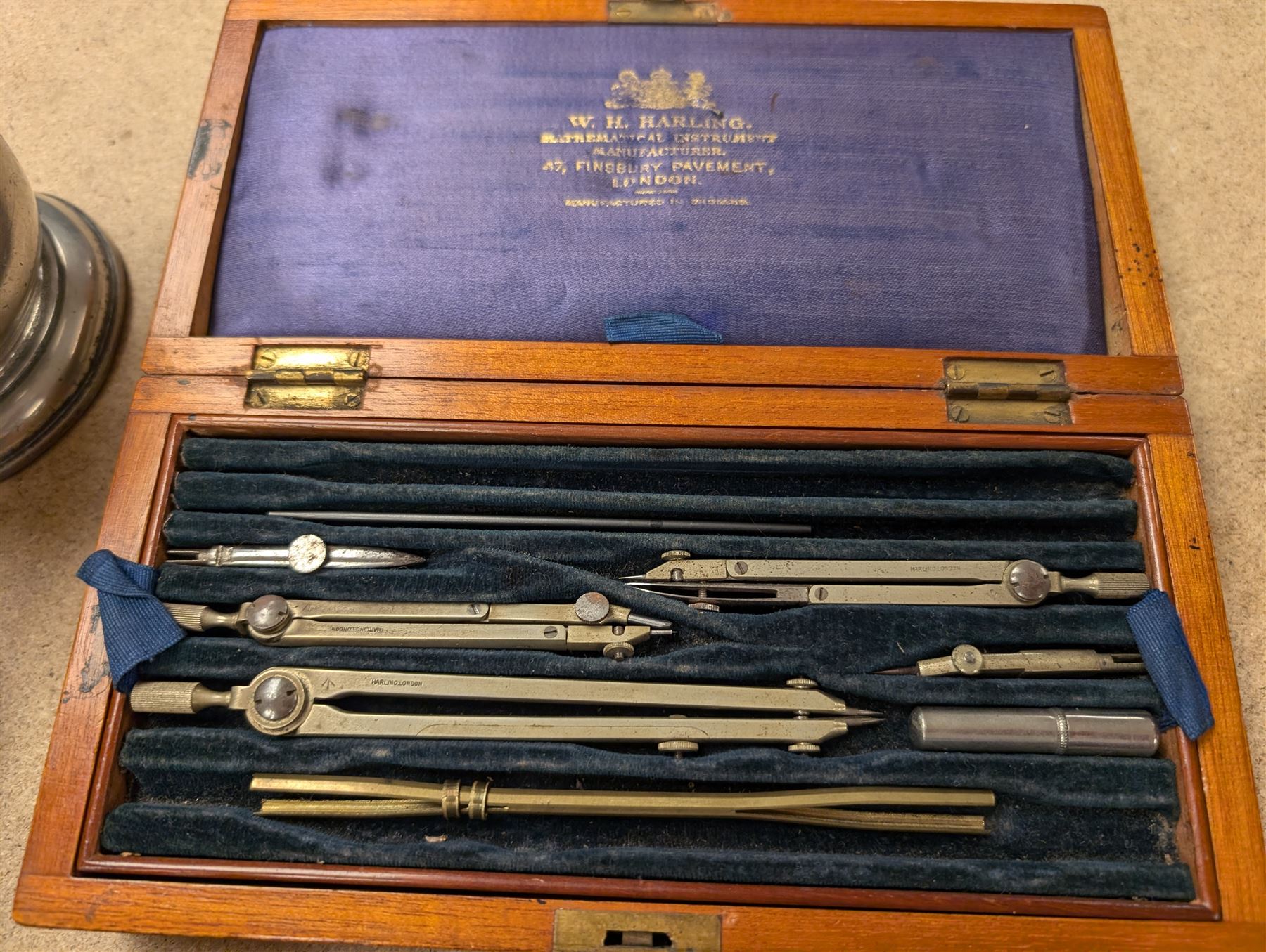 Reproduction miniature copper diving helmet, silver plated hip flask, early 20th century writing set by W.H. Harling, powder flask, two pewter tankards, etc