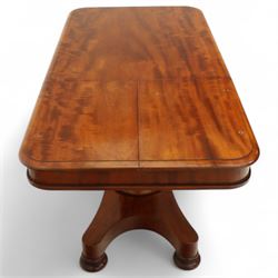William IV mahogany reading table, the rectangular top with rounded corners and moulded edge, one end fitted with two hinged adjustable reading slops with two rests, the sliding top with a sprung stay mechanism, supported on a single tapered faceted column  with turned collar on a quatreform base with compressed bun feet