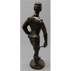  Cast bronze figure of a French soldier wearing uniform and kepi standing holding a sword H37cm  